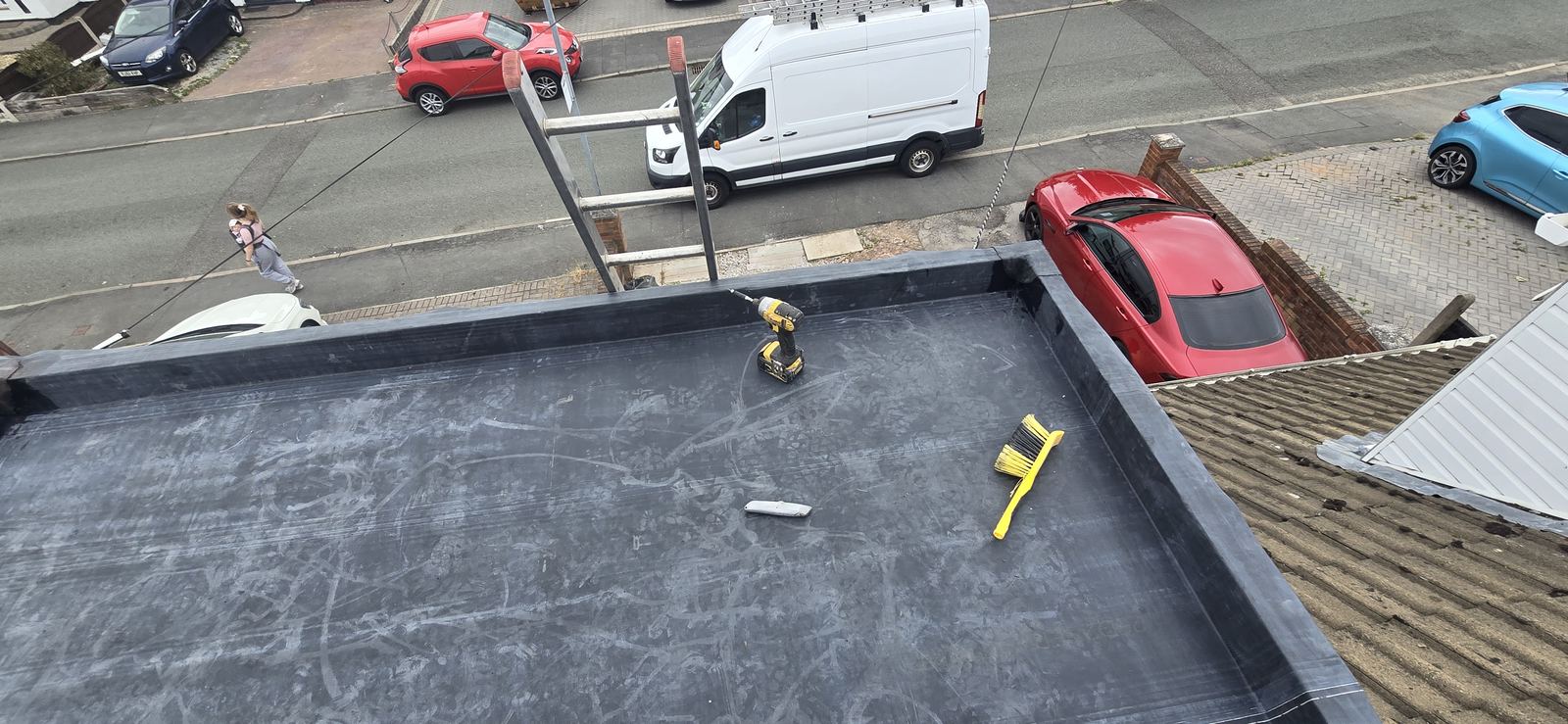 Finished flat roof recovered in black EPDM rubber membrane