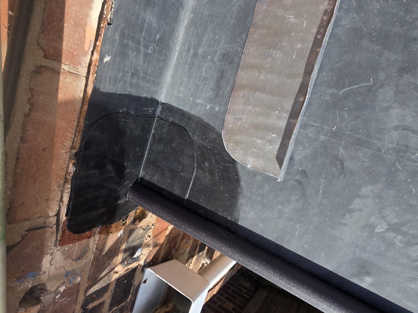 EPDM corner detail formed and sealed with FormFlash at the wall upstand