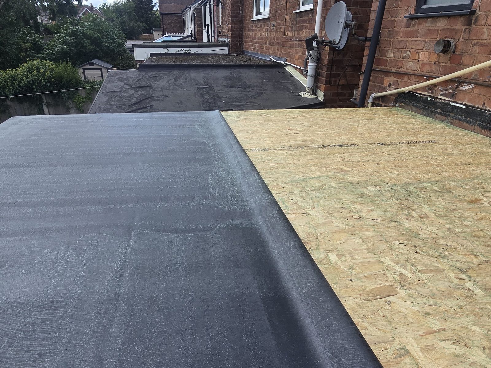 New 18mm OSB deck with EPDM rubber membrane half bonded and half folded back