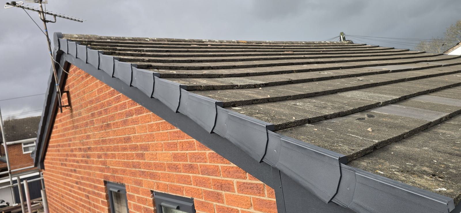 New anthracite grey UPVC fascia and guttering fitted along the roofline