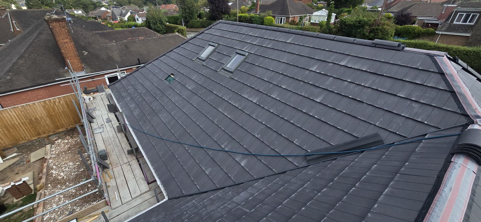 Dry hip system being fitted to the hips of the new roof