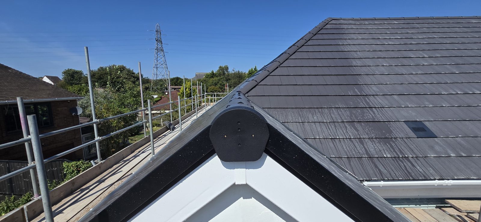 Close-up of the dry verge and ridge end cap on the front gable