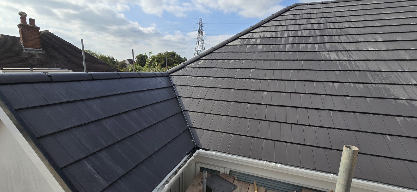 Finished valley between the extension and the main roof, with new guttering